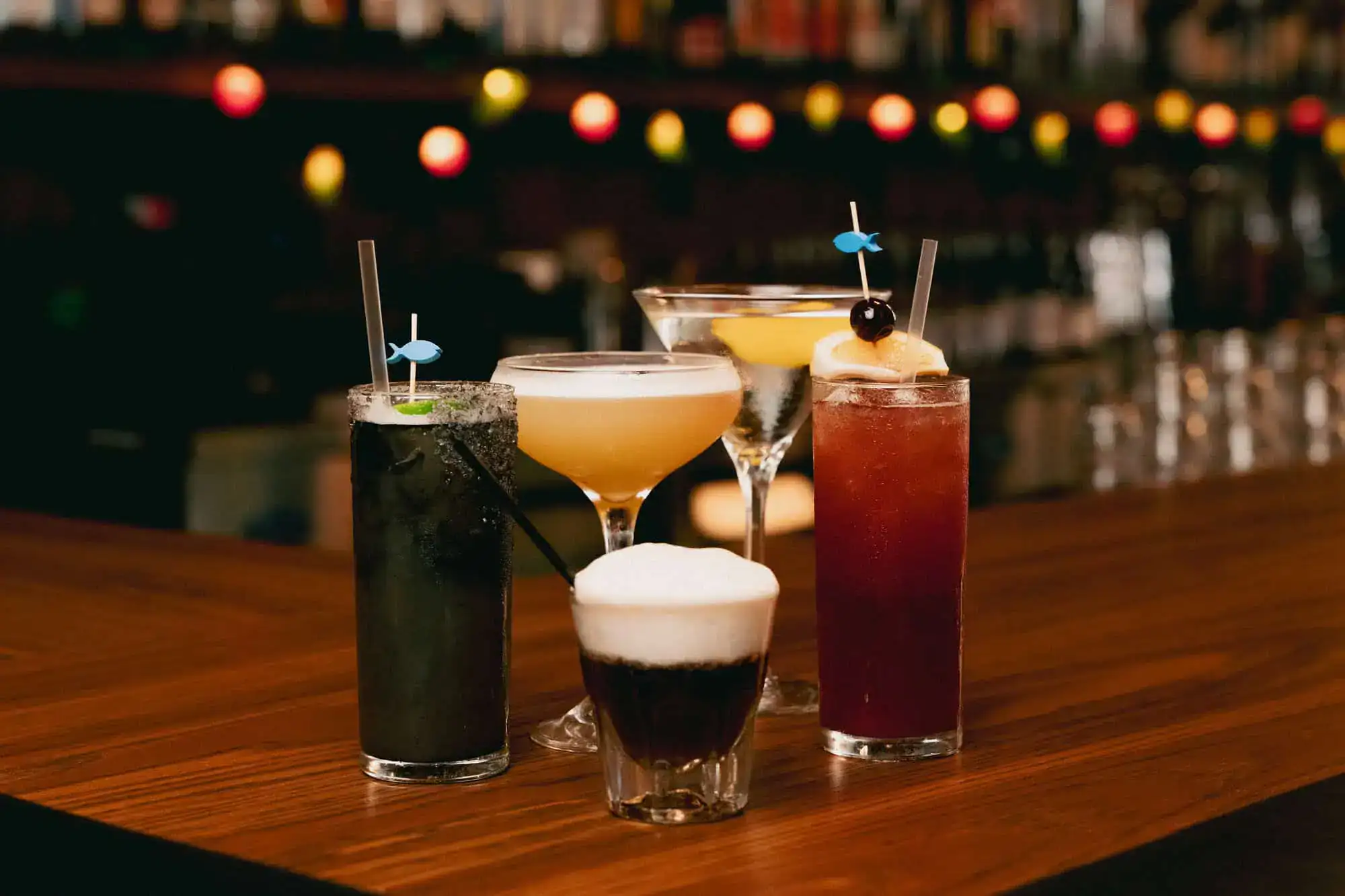 Variety of colorful cocktails on bar counter at Bill's Bait Shop.